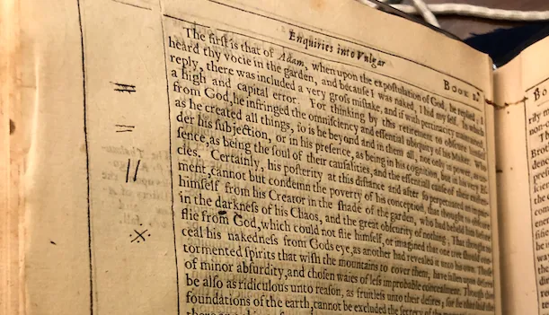 A printed page of a book showing Coleridge's actual marginal symbols including equals signs and double lines in the margins