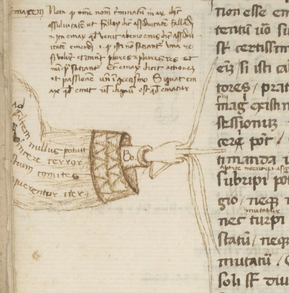 A medieval Latin manuscript with a hand-drawn manicule — a pointing hand with a decorated sleeve — in the left margin, used to flag important text
